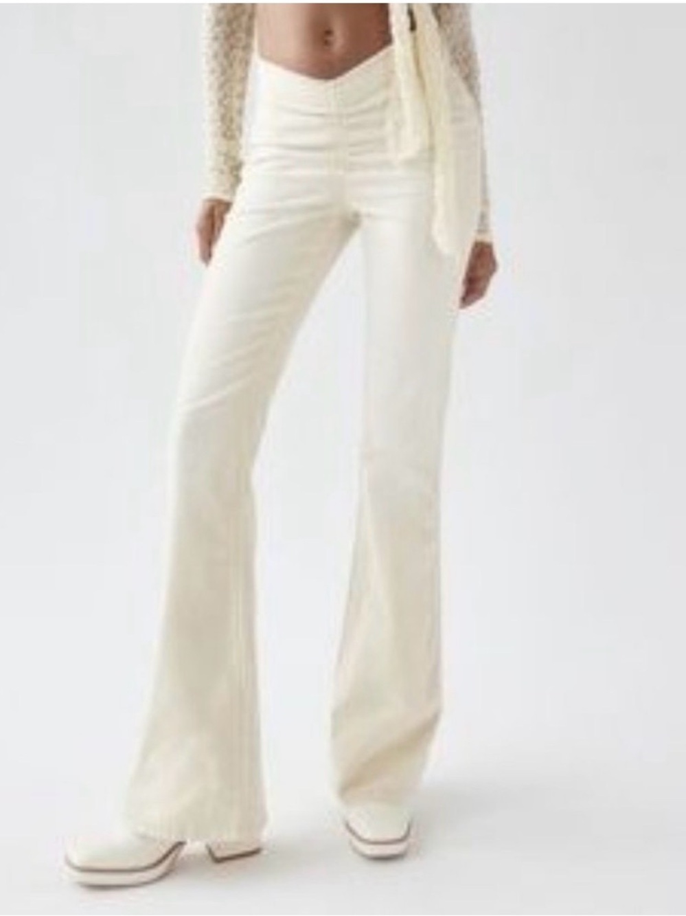 Urban Outfitters UO Velvet Ruched V-Front Flare Pants in Cream.